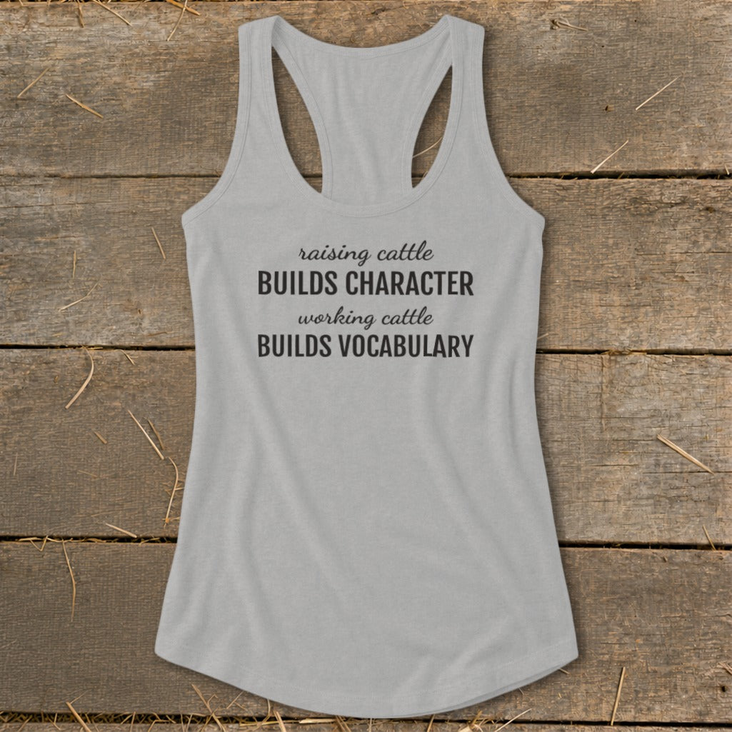 Light grey tank top with text "raising cattle BUILDS CHARACTER working cattle BUILDS VOCABULARY".
