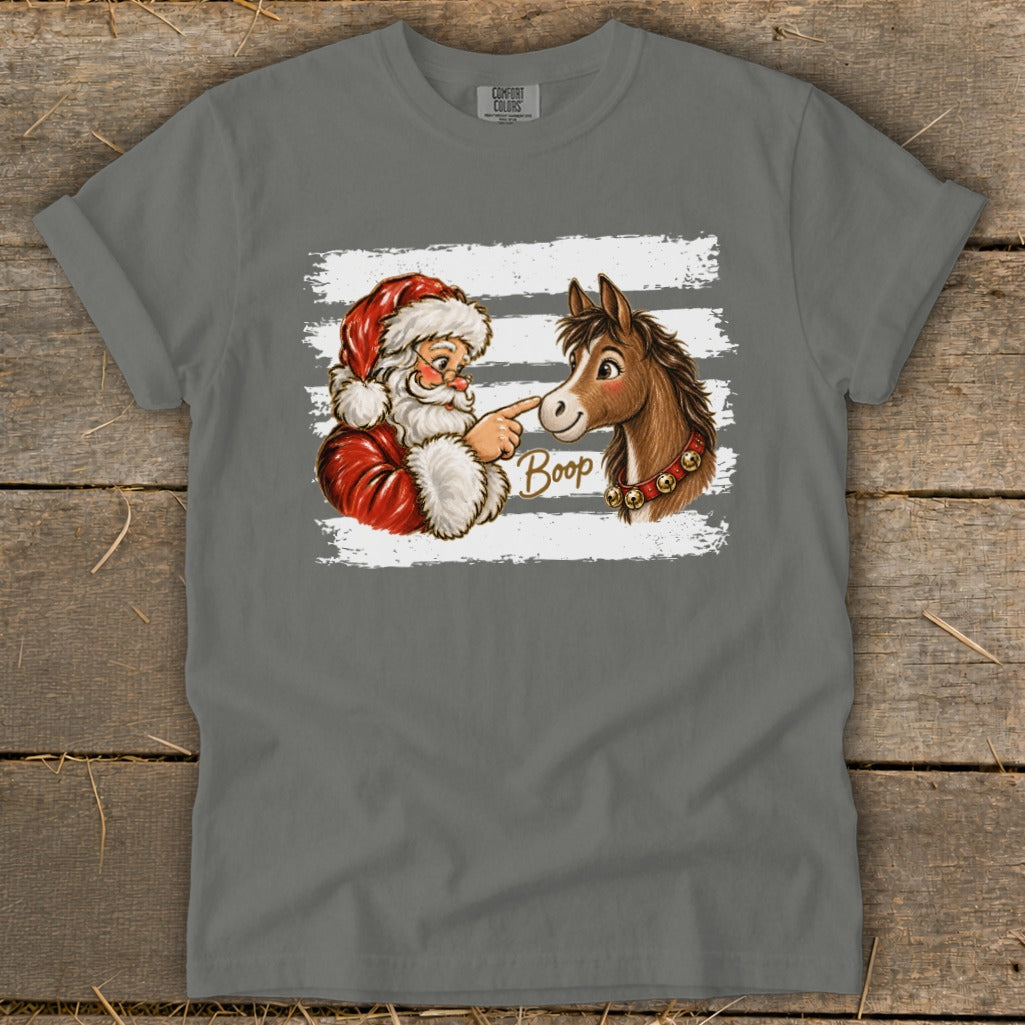 Santa booping a horse with the word "Boop" on a t-shirt.