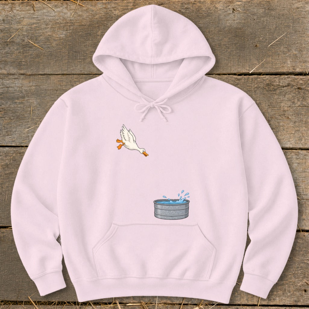 Light pink hoodie with a cartoon duck leaping towards a galvanized tub of water.