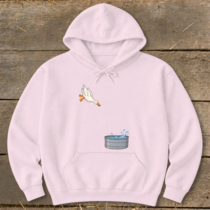 Light pink hoodie with a cartoon duck leaping towards a galvanized tub of water.