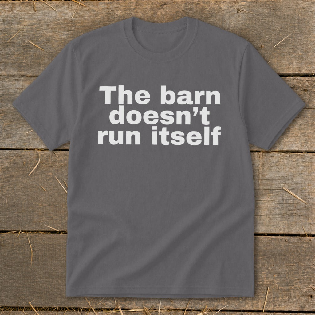 Dark grey t-shirt with white text that reads "The barn doesn't run itself".