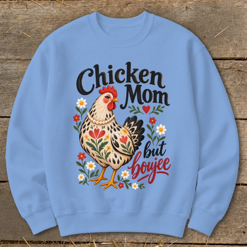 Chicken Mom but boujee text with a floral chicken illustration on a light blue sweatshirt.