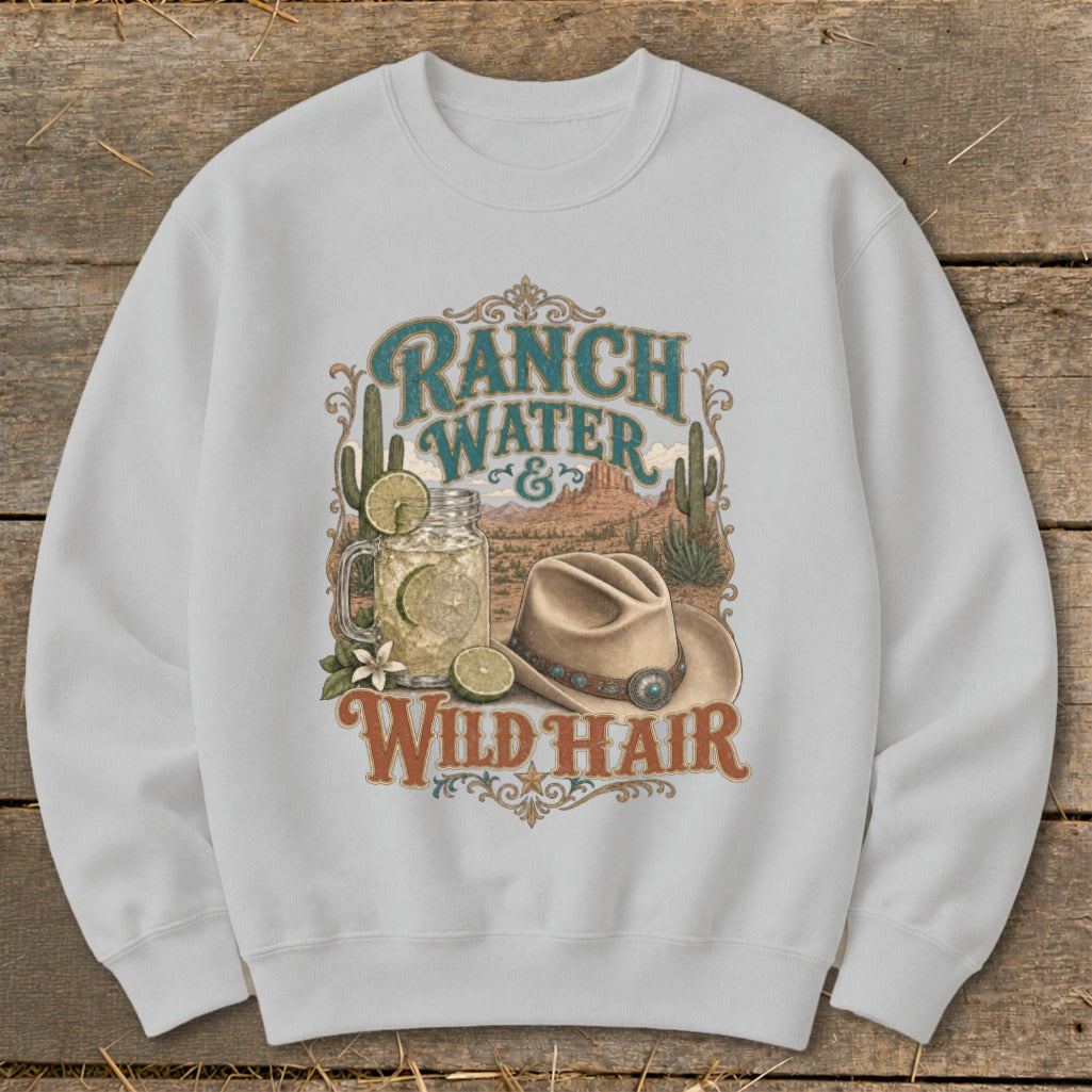 White sweatshirt with "Ranch Water & Wild Hair" desert graphic and cowboy hat.