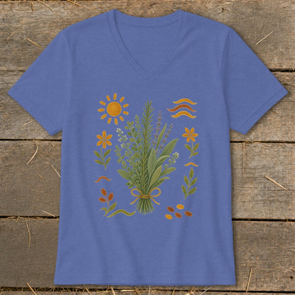 Purple v-neck t-shirt with botanical illustration and sun motif.
