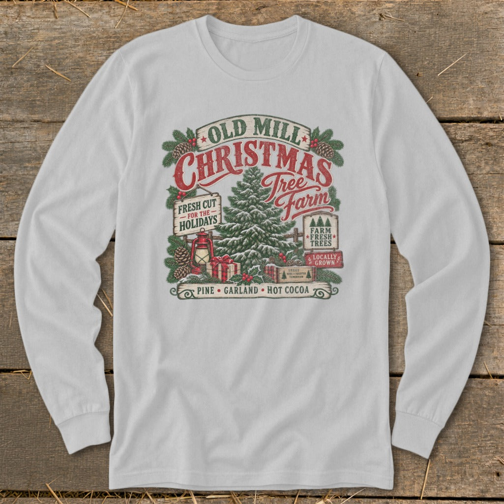 White long sleeve shirt with Old Mill Christmas Tree Farm graphic featuring a tree, lantern, and gifts.