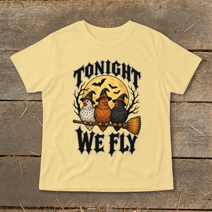 Three chickens in witch hats sit on a broom with "Tonight We Fly" text.