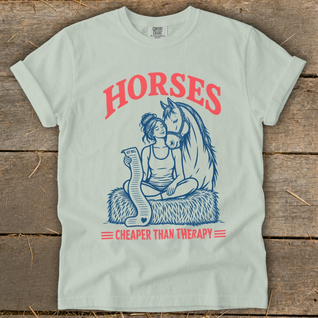 T-shirt graphic of woman hugging horse, holding a long vet bill, with text "Horses Cheaper Than Therapy".