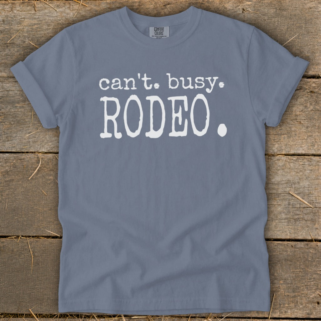 Blue t-shirt with white text that says "can't. busy. RODEO."