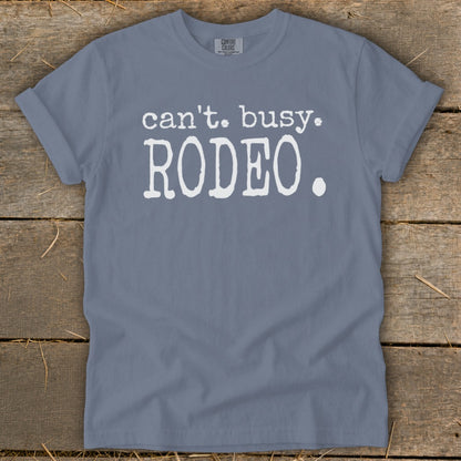Blue t-shirt with white text that says "can't. busy. RODEO."