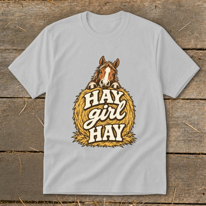Light grey t-shirt with a horse peeking over a hay bale with "HAY girl HAY" text.