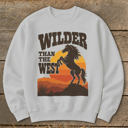 White sweatshirt with "Wilder Than The West" text and rearing horse graphic.