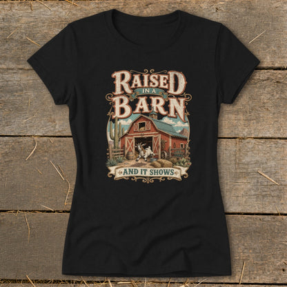 Black t-shirt with "Raised in a Barn And It Shows" text and barn graphic.