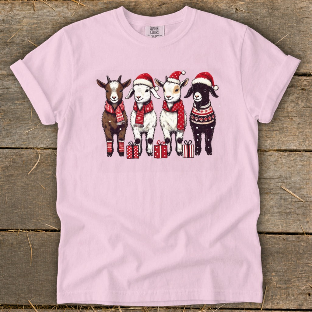 Four cartoon goats wear Santa hats and scarves, with gifts below.