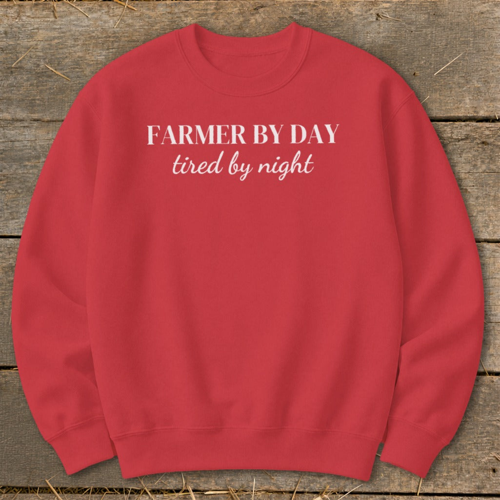 Red sweatshirt with "Farmer by day, tired by night" text.
