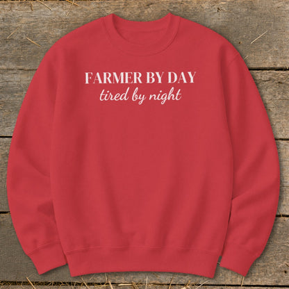Red sweatshirt with "Farmer by day, tired by night" text.