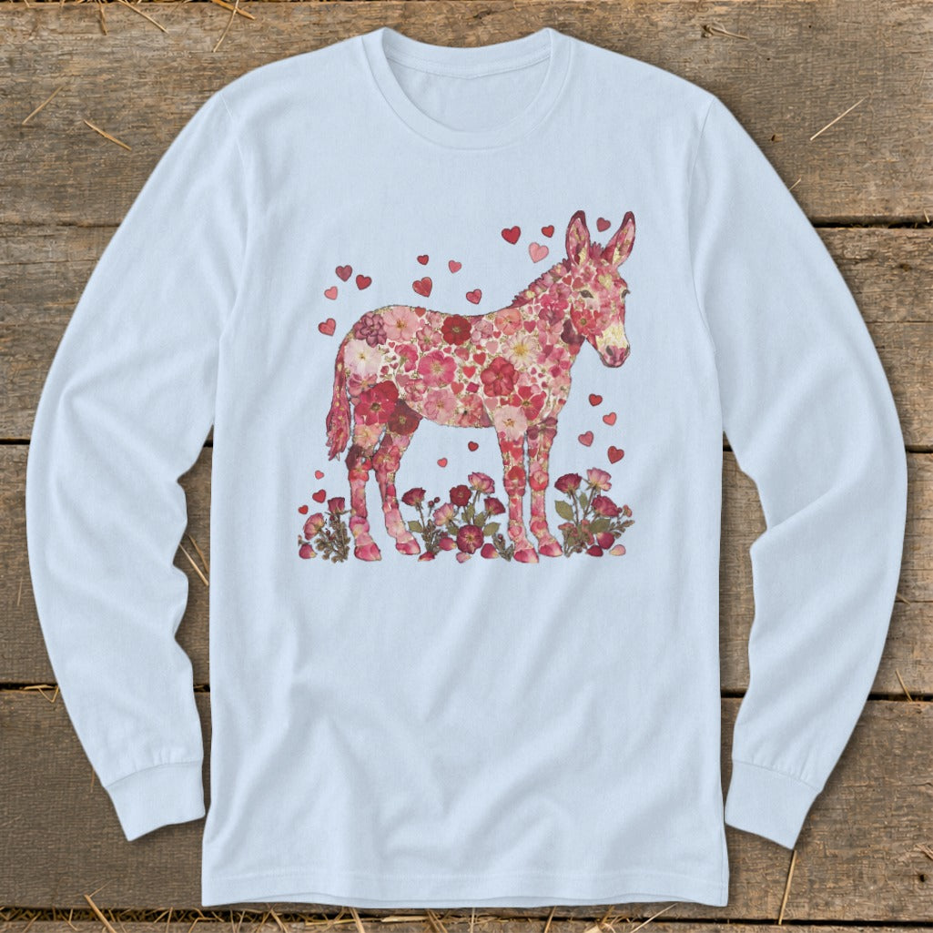 Donkey silhouette made of pink and red flowers and hearts on a light blue shirt.