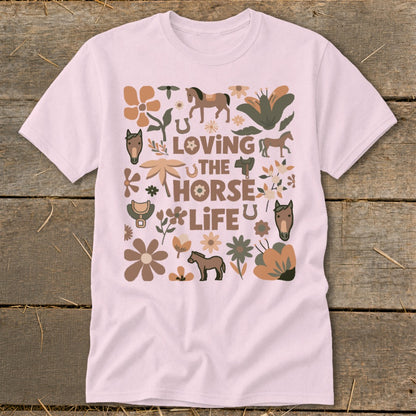 Pink t-shirt with "Loving the Horse Life" text and horse, flower, and horseshoe graphics.