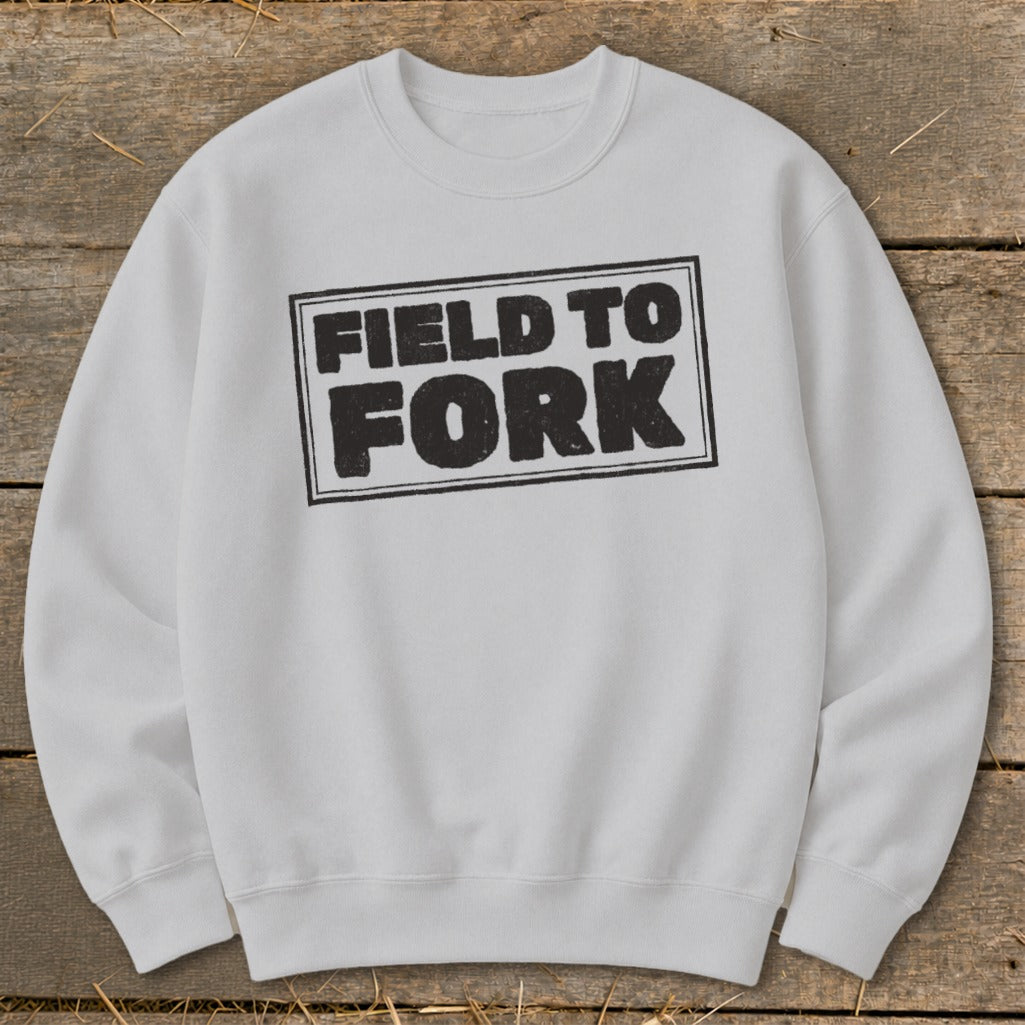 Light gray crewneck sweatshirt featuring a black boxed graphic that reads Field to Fork.