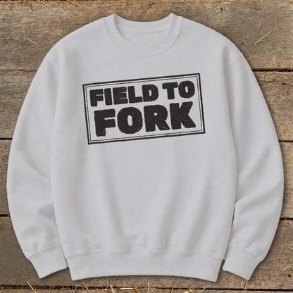 Light gray crewneck sweatshirt featuring a black boxed graphic that reads Field to Fork.