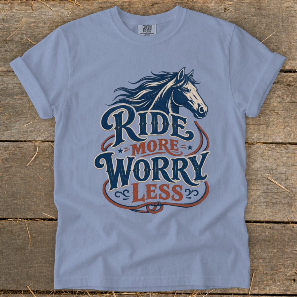 Blue t-shirt with horse graphic and "Ride More Worry Less" text.