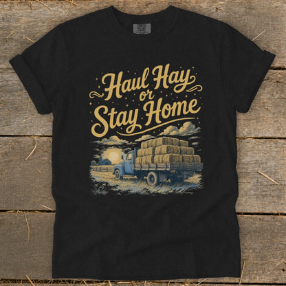 Black t-shirt with "Haul Hay or Stay Home" text and a truck loaded with hay bales.