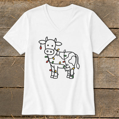 White t-shirt with a black line drawing of a cow decorated with colorful Christmas lights.
