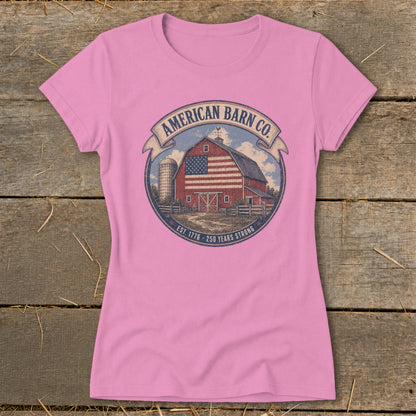 Pink t-shirt with American Barn Co. logo featuring a barn with US flag and silo.