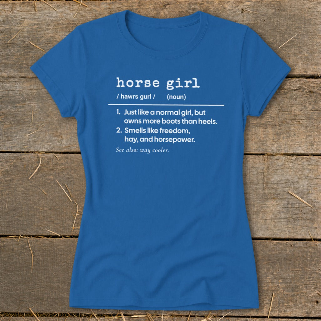Blue t-shirt with "horse girl" definition: owns more boots, smells like freedom, hay, horsepower.