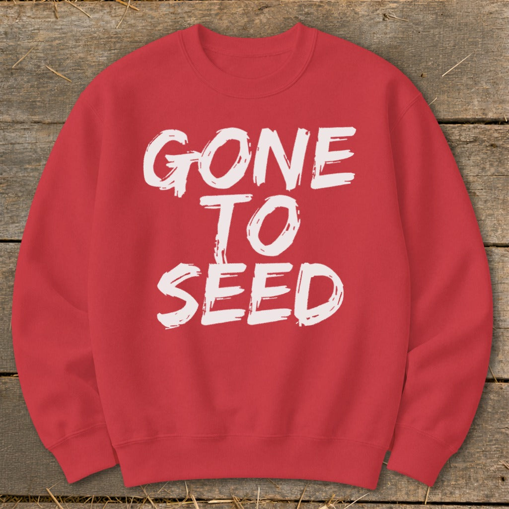 Red sweatshirt with white distressed text reading "GONE TO SEED".