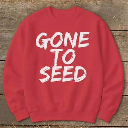 Red sweatshirt with white distressed text reading "GONE TO SEED".