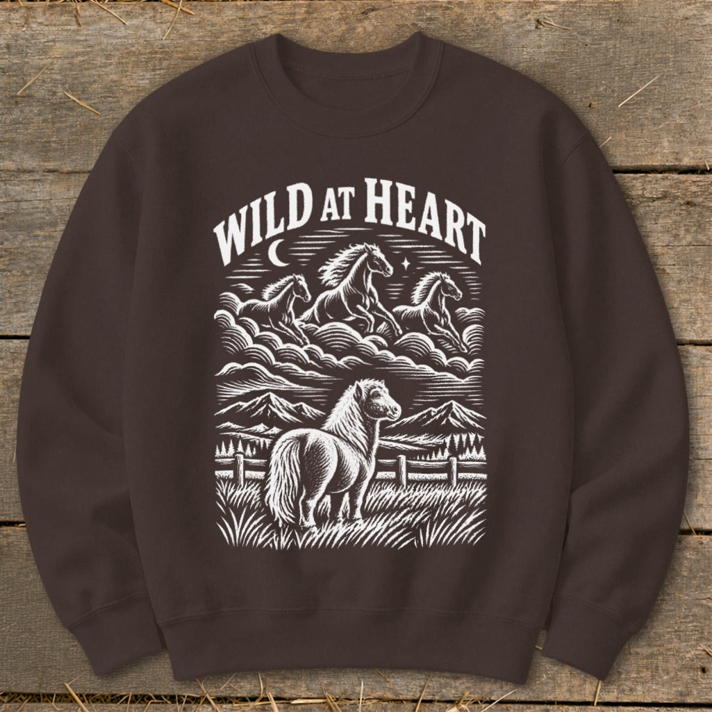 Brown sweatshirt with white illustration of horses and "Wild at Heart" text.