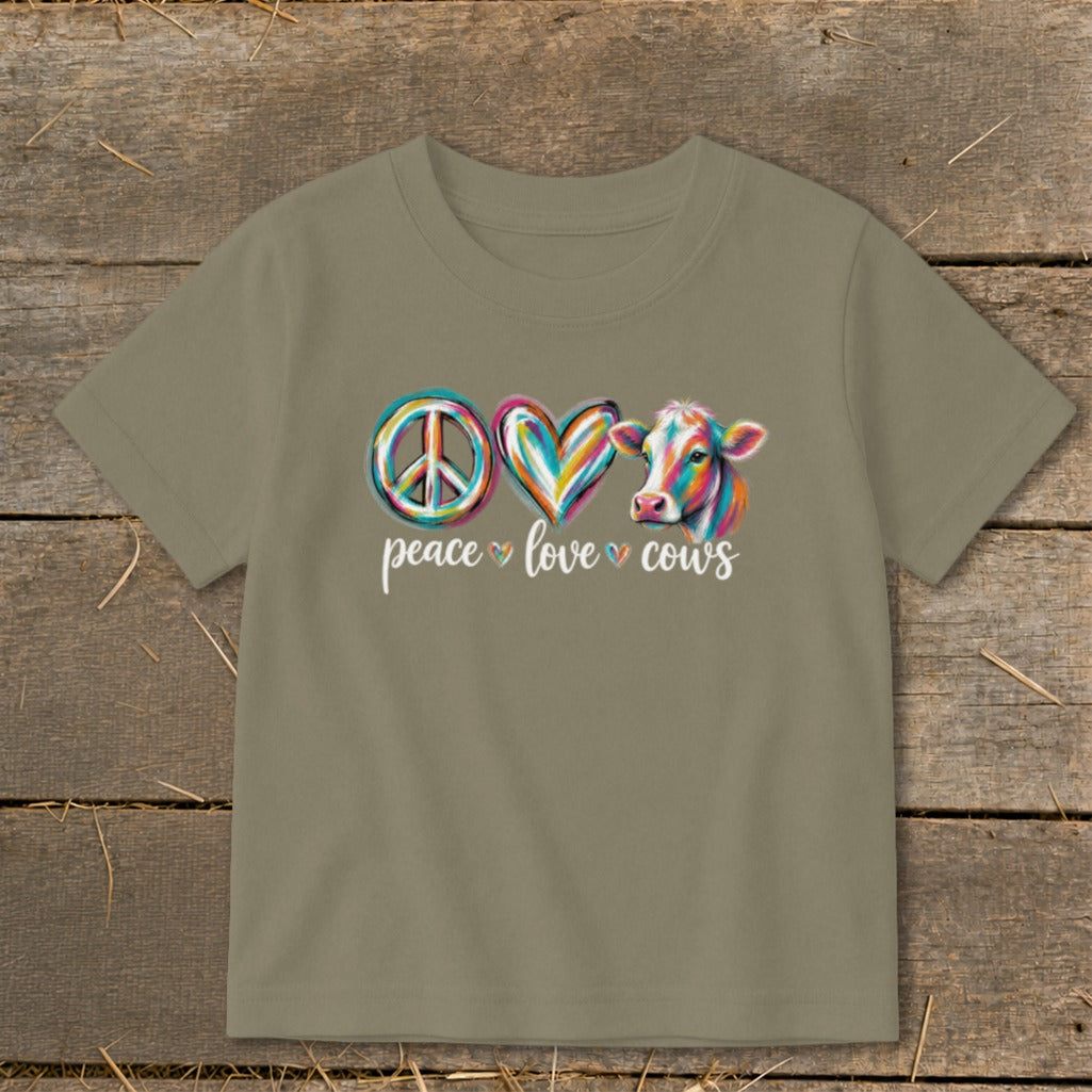 T-shirt with "peace love cows" text, peace sign, and colorful cow.