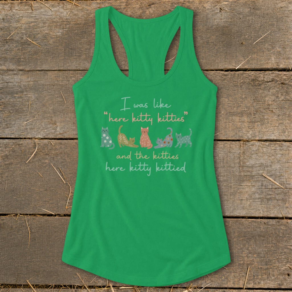 Green tank top with text and colorful kittens.