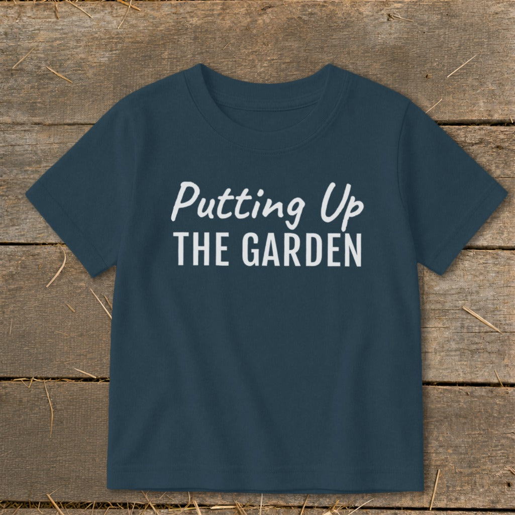 Navy t-shirt with white text that reads "Putting Up THE GARDEN".