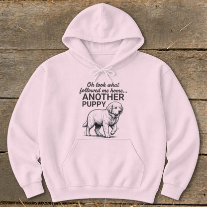 Pink hoodie with "Oh look what followed me home... ANOTHER PUPPY" text and puppy graphic.