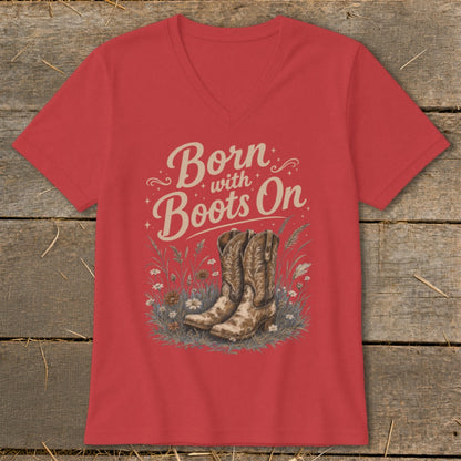 Red v-neck t-shirt with "Born with Boots On" text and cowboy boots graphic.