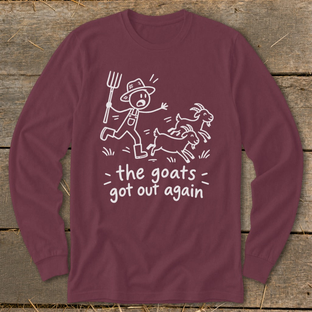 Maroon long-sleeve shirt with white graphic of farmer chasing goats saying "the goats got out again".