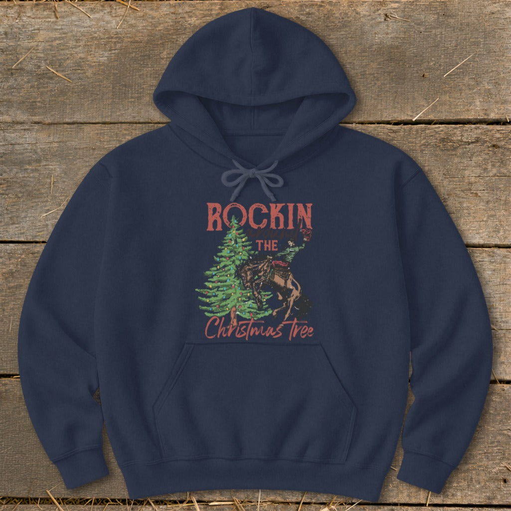 Navy hoodie with a distressed graphic of a cowboy riding a horse next to a Christmas tree.
