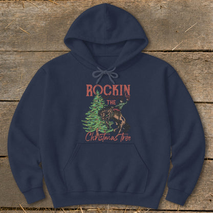 Navy hoodie with a distressed graphic of a cowboy riding a horse next to a Christmas tree.