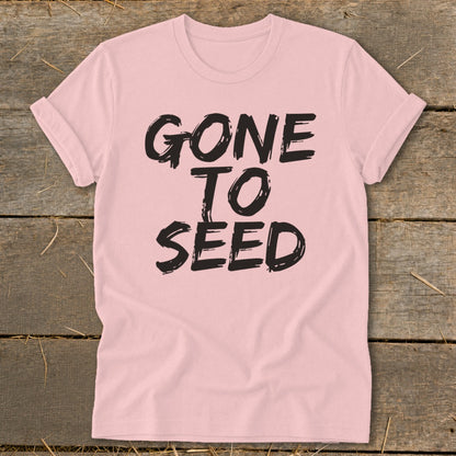Pink t-shirt with black text that reads "GONE TO SEED".