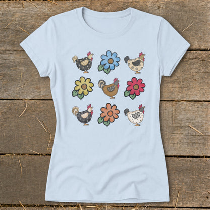 Light blue t-shirt with a pattern of cartoon chickens and flowers.