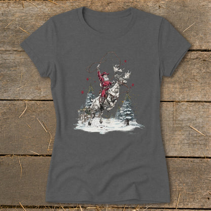 Santa riding a reindeer with lasso in a snowy winter scene with pine trees.