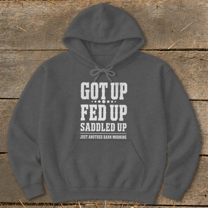 Dark grey hoodie with white text: "GOT UP FED UP SADDLED UP JUST ANOTHER BARN MORNING"