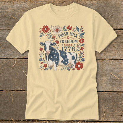 Yellow t-shirt with a patriotic cow and "Fresh Milk & Freedom Since 1776" text.