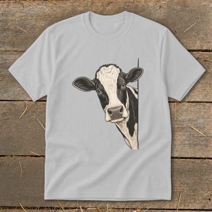 Black and white cow peeking from the side on a light gray t-shirt.