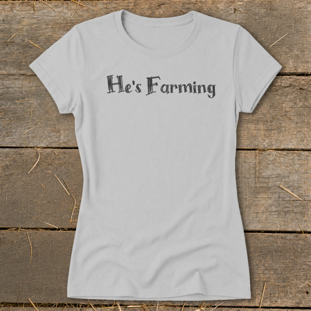 Light grey t-shirt with black text "He's Farming" on the chest.