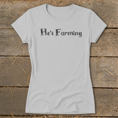 Light grey t-shirt with black text "He's Farming" on the chest.