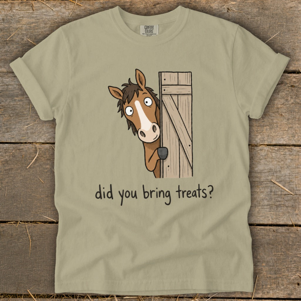 Tan t-shirt with cartoon horse peeking from a wooden gate asking "did you bring treats?"