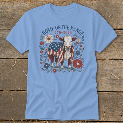 Cow with American flag draped over its back, surrounded by flowers and text.