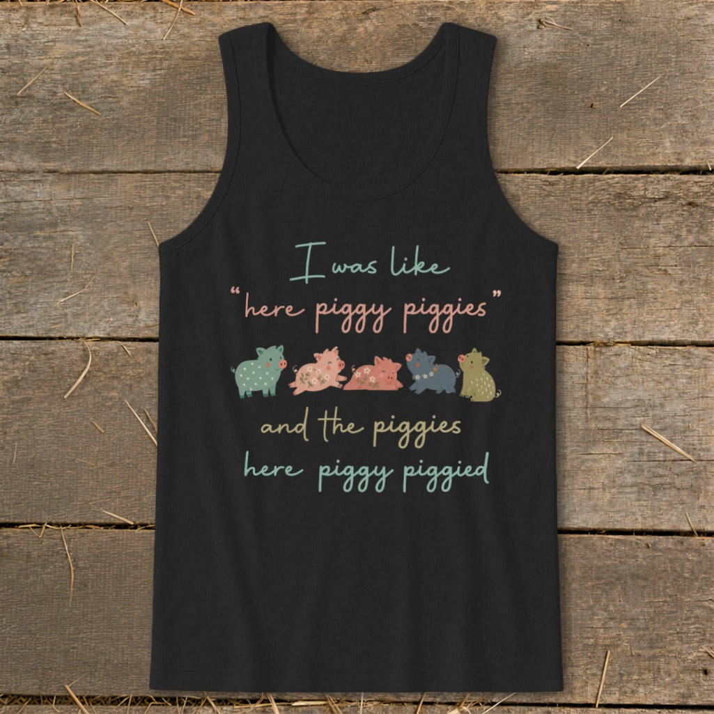 Black tank top with cartoon pigs and text: "I was like "here piggy piggies" and the piggies here piggy piggied."